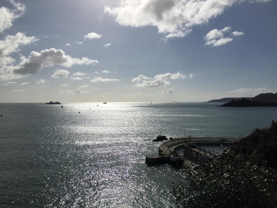 A view out to sea from Plymouth Hoe. Navy Ship and the Lido,